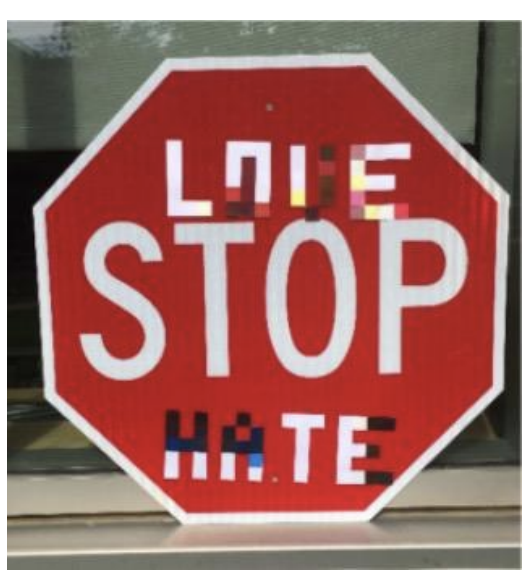 A stop sign overlayed with text to cause it to be misclassified